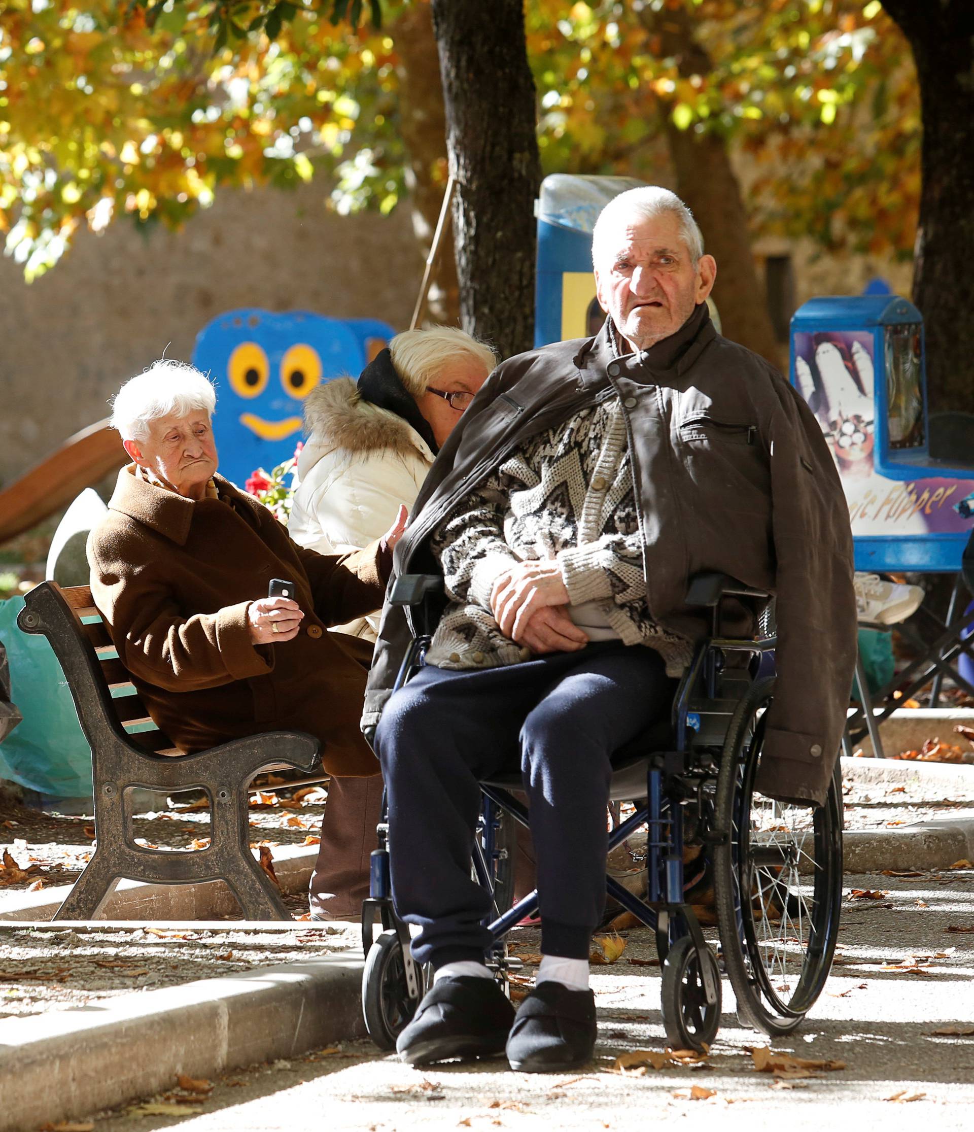 People are seen on the road following an earthquake in Norcia