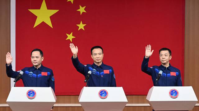 Astronauts Fei Junlong, Deng Qingming and Zhang Lu attend a news conference before the Shenzhou-15 spaceflight mission, at Jiuquan Satellite Launch Center