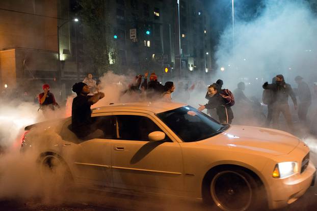 A demonstrator performs a burnout during a protest against the election of Republican Donald Trump as President of the United States in Portland