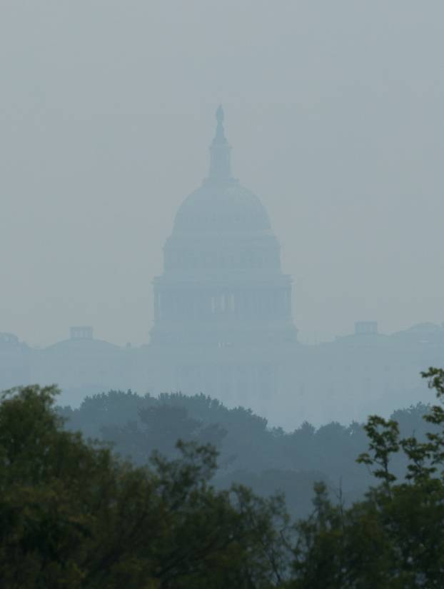Smoke from Canadian wildfires clouds the National Mall and monuments in Washington