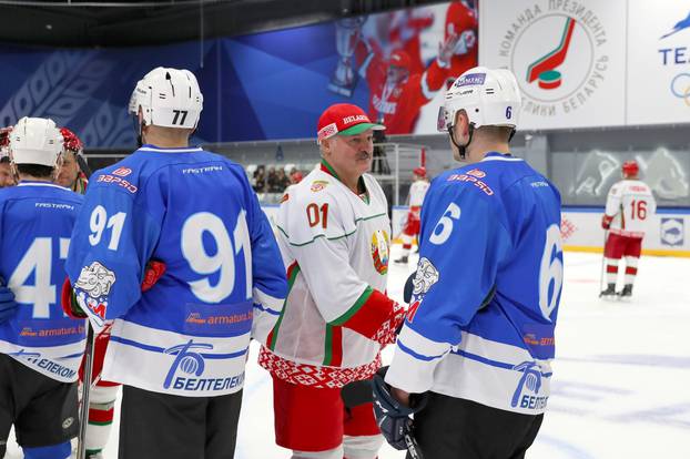 Belarusian President Alexander Lukashenko takes part in an amateur ice hockey game in Minsk