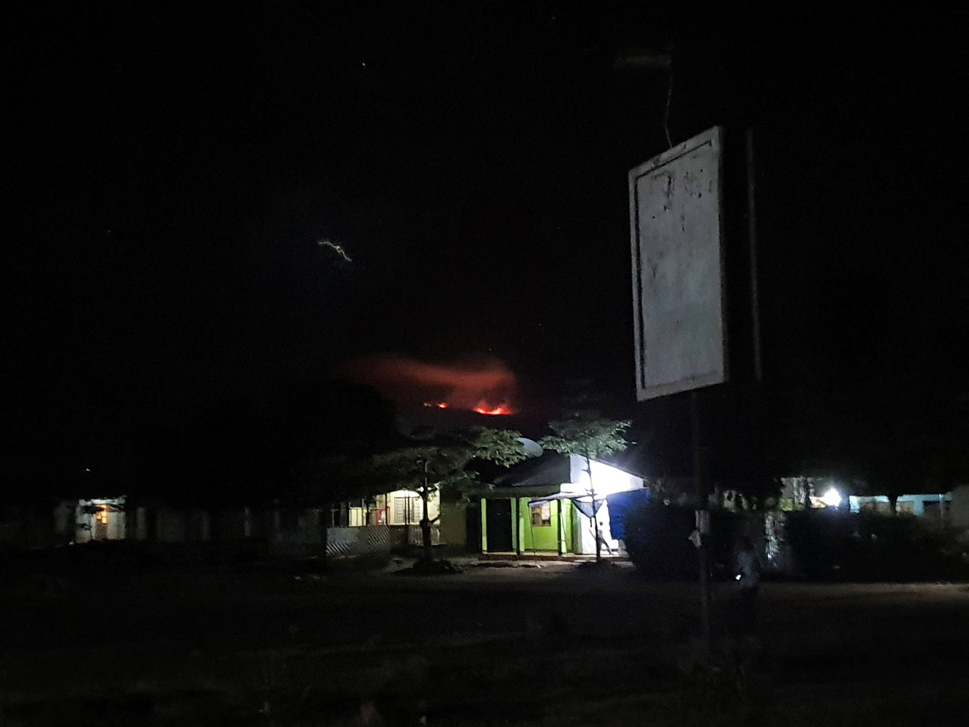 View of fire's glow on Mt Kilimanjaro seen from Moshi