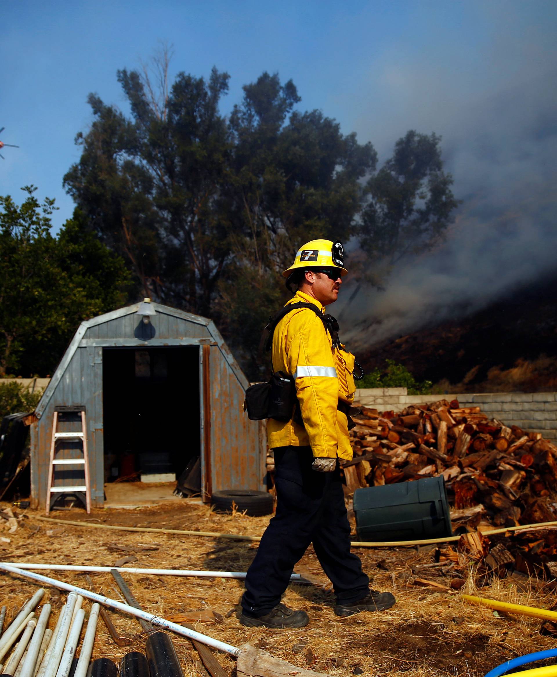 Firefighters battle the Peak fire in Simi Valley