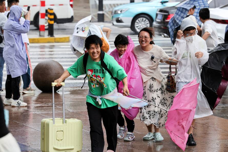 Heavy rain and high winds in Shanghai after Tropical Storm Co-May made landfall in a nearby city