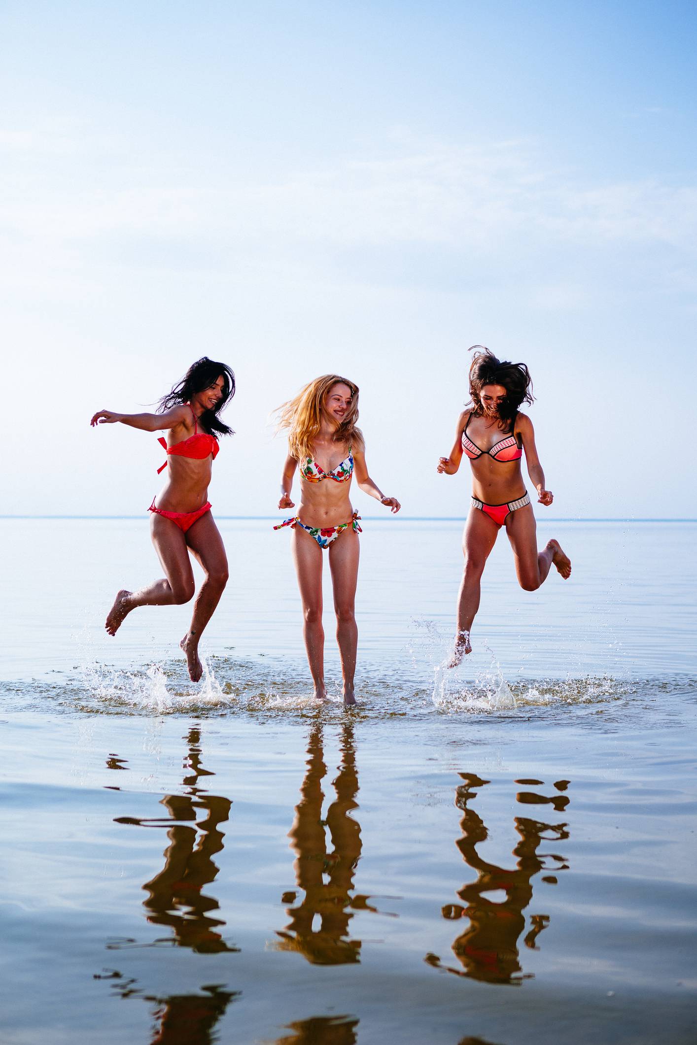 Vacation. Beach Party. Teenage girls having fun in water. Group