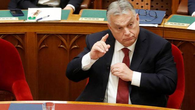 Hungarian Prime Minister Orban gestures before he addresses the Parliament in Budapest