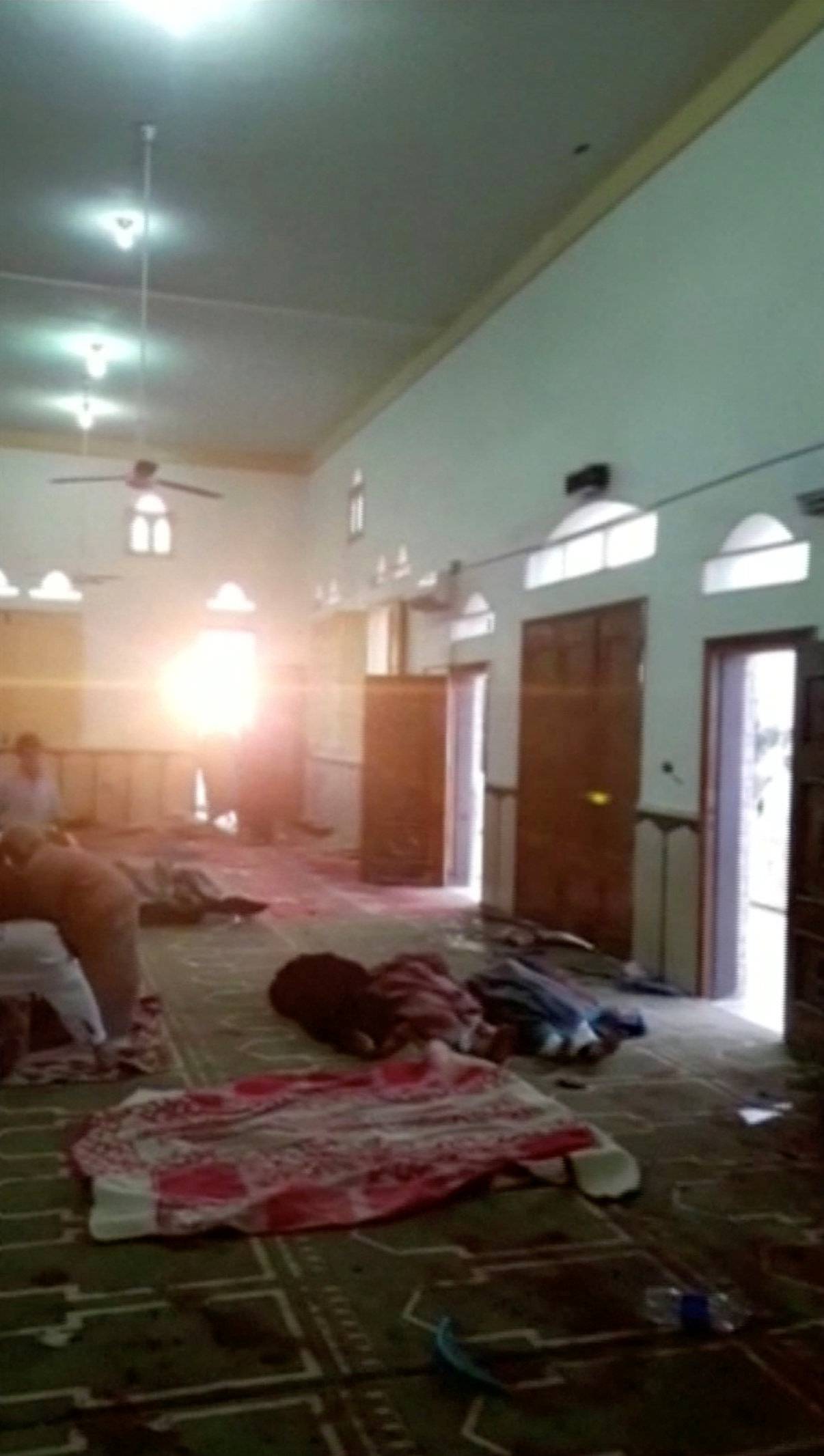 Bodies are seen inside Al Rawdah mosque in Bir Al-Abed