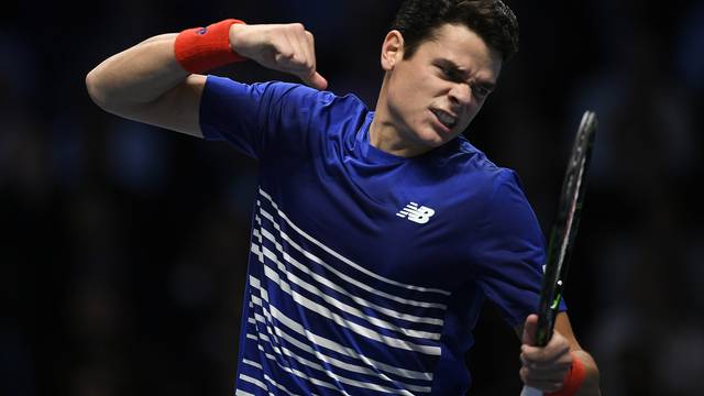 Canada's Milos Raonic celebrates during his round robin match with Austria's Dominic Thiem