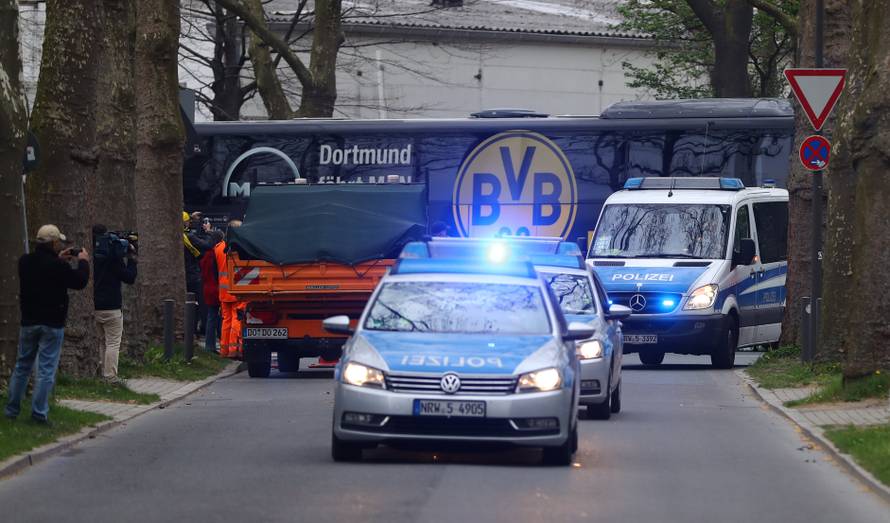 The Dortmund team bus arrives with a Police escort before the match