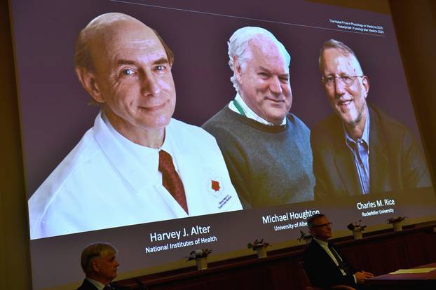 Harvey J. Alter, Michael Houghton and Charles M. Rice, are seen on a screen as the three laureates as they are announced as the winners of the 2020 Nobel Prize in Physiology or Medicine during a news conference at the Karolinska Institute in Stockholm