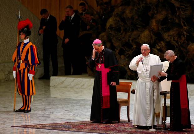 Pope Francis blesses at the end of his Wednesday general audience at the Paul VI audience hall in Vatican City