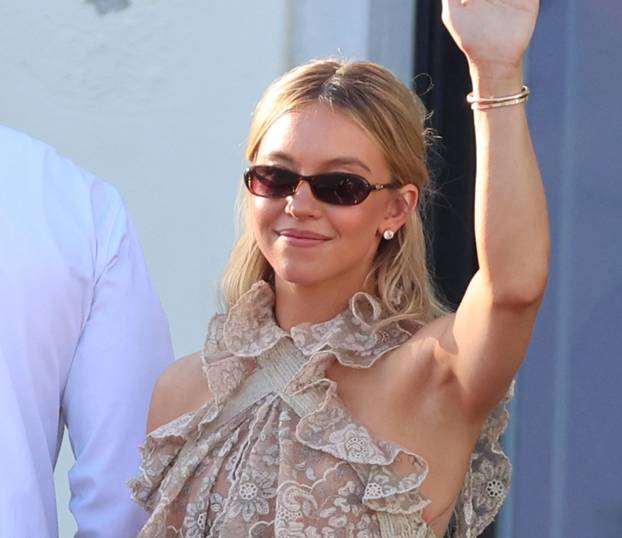 Sydney Sweeney arrives at the Hotel St Regis in Venice with a friend