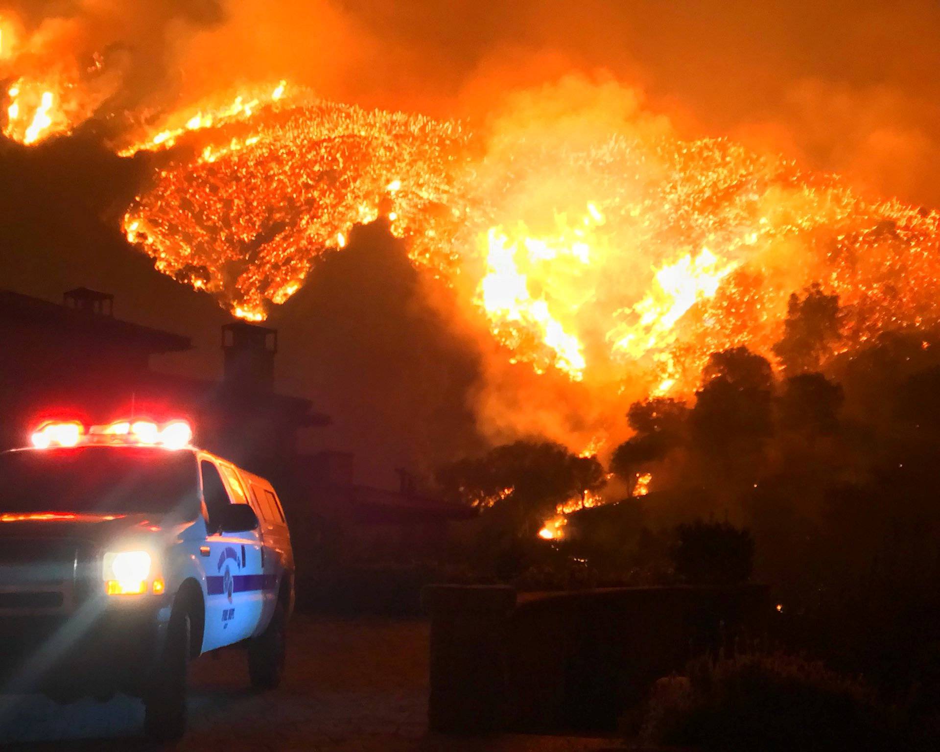Thomas wildfire burns above Bella Vista Drive near Romero Canyon in this social media photo by Santa Barbara County Fire Department in Montecito California