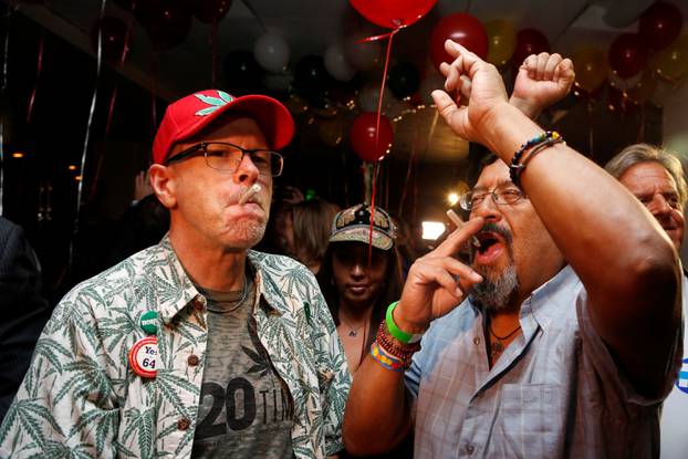 Britt and Moreno celebrate after Californians voted to pass Prop 64, legalizing recreational use of marijuana in the state, in Los Angeles, California