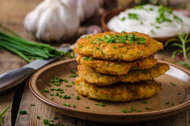 Potato,Pancakes,With,Sour,Cream,,Herbs,And,Garlic,In