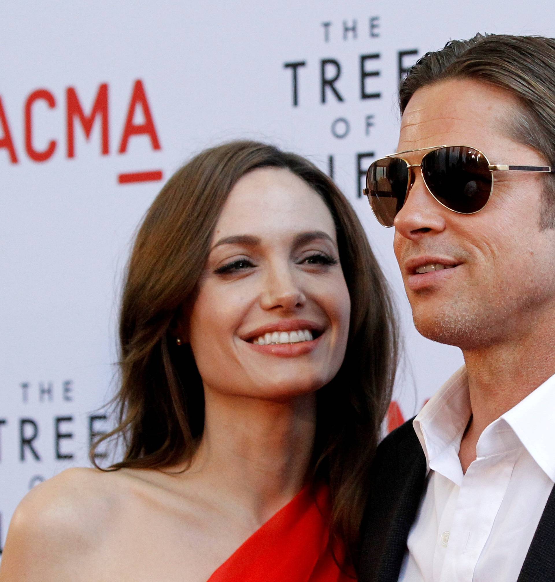 FILE PHOTO: Pitt and Jolie pose at the premiere of "The Tree of Life" at LACMA in Los Angeles