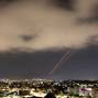 Objects are intercepted in the sky after Iran launched drones and missiles towards Israel, as seen from Ashkelon