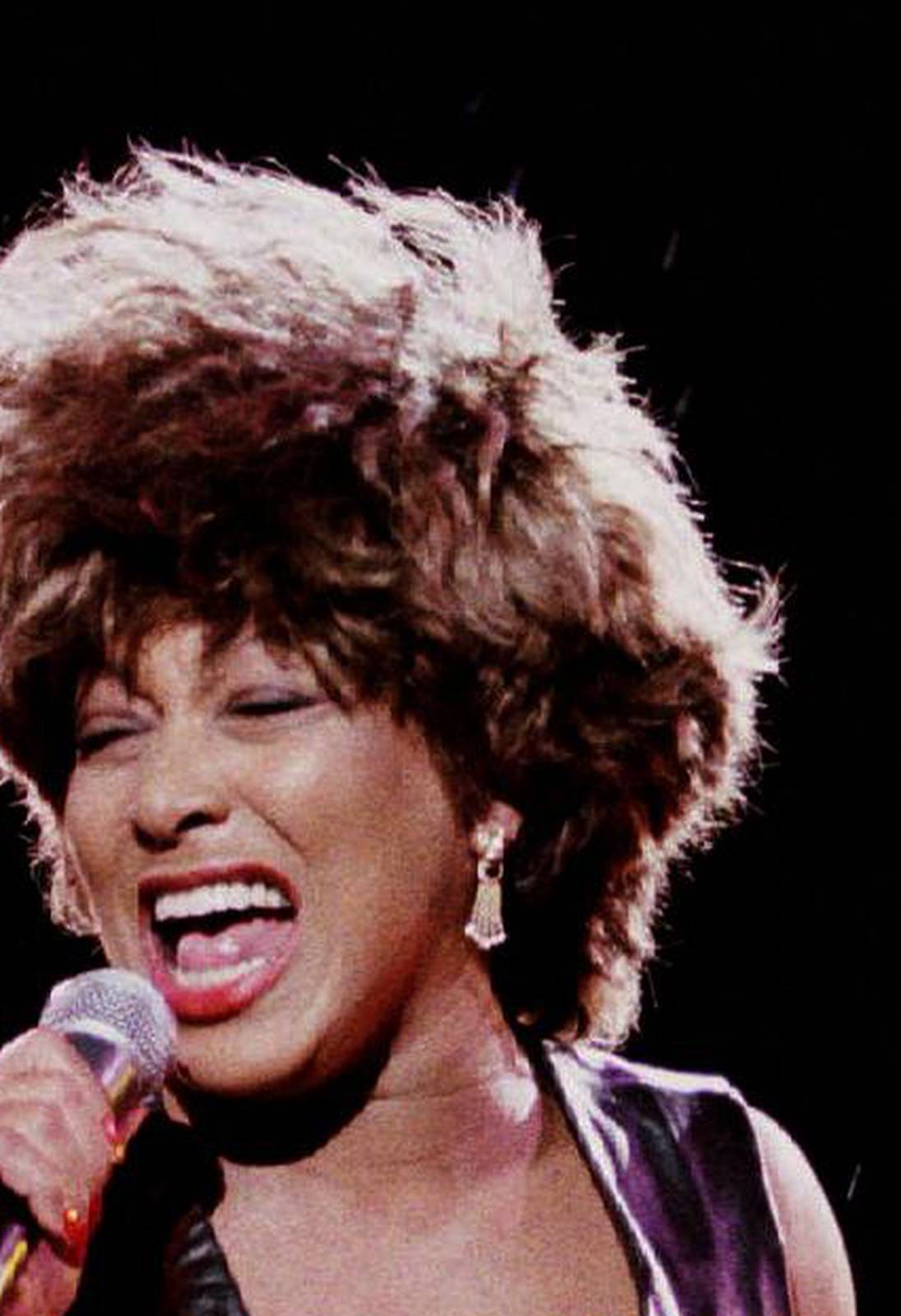 FILE PHOTO: Pop star Tina Turner performs during rainfall in the "Rock over danube" festival in Vienna