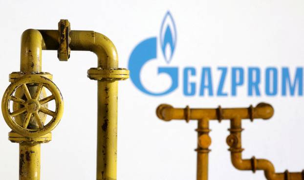 FILE PHOTO: Illustration shows natural gas pipeline and Gazprom logo