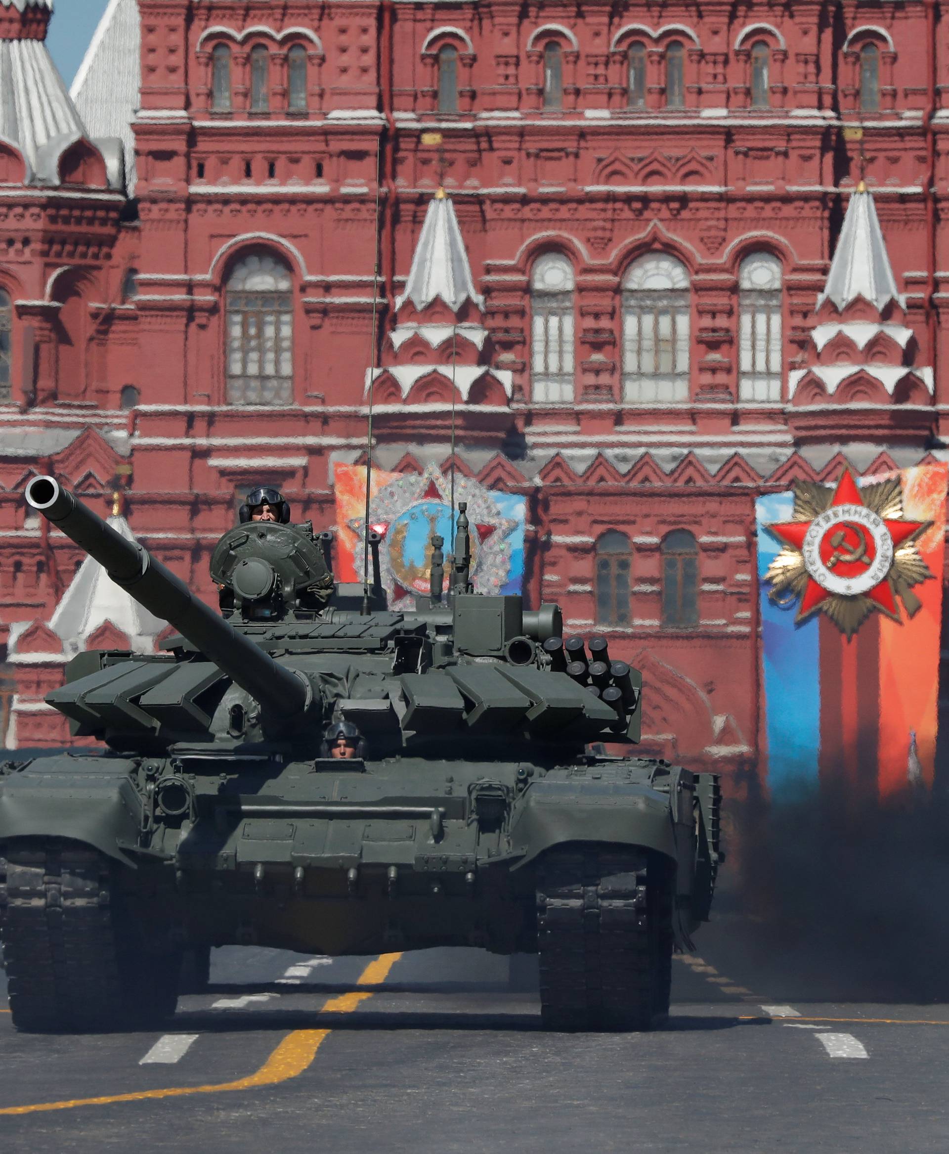 Russian servicemen drive tanks during the Victory Day parade at the Red Square in Moscow
