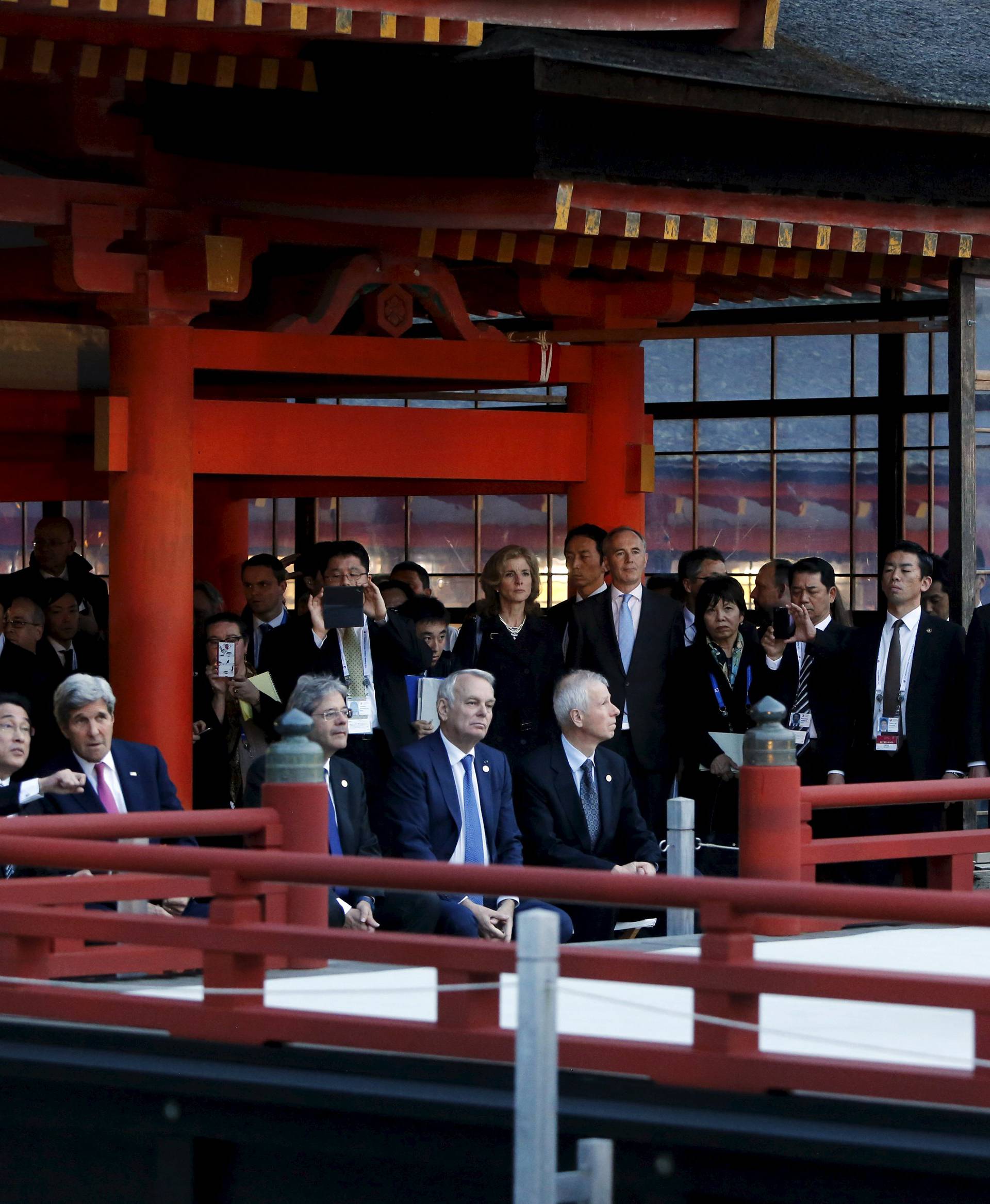 Kerry talks to Kishida during a ceremonial dance at the Itsukushima Shrine, as they and Hammond, Gentiloni, Ayrault and Dion take a cultural break from their G7 foreign minister meetings in nearby Hiroshima to visit Miyajima Island