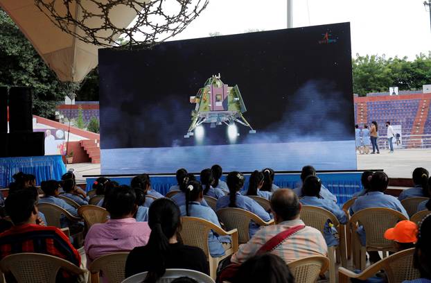 People watch a live stream of Chandrayaan-3 spacecraft's landing on the moon, in Ahmedabad