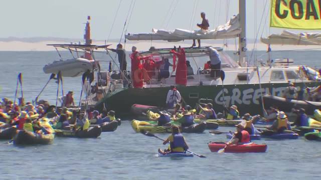 Australia climate change protest forces ship to abort arrival at coal port, 138 arrested