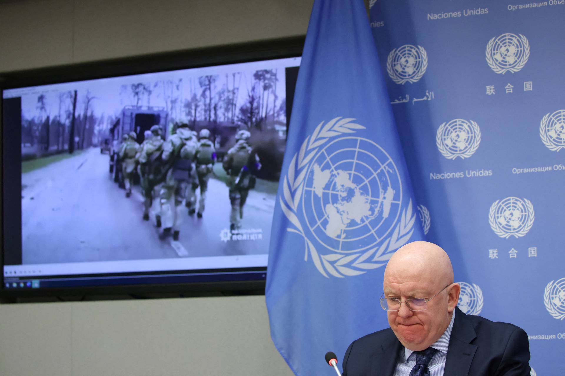 Russian Ambassador to the UN Vassily Nebenzia plays video allegedly captured in Ukraine to journalists as he addresses the Russian invasion of Ukraine at the United Nations Headquarters in New York City