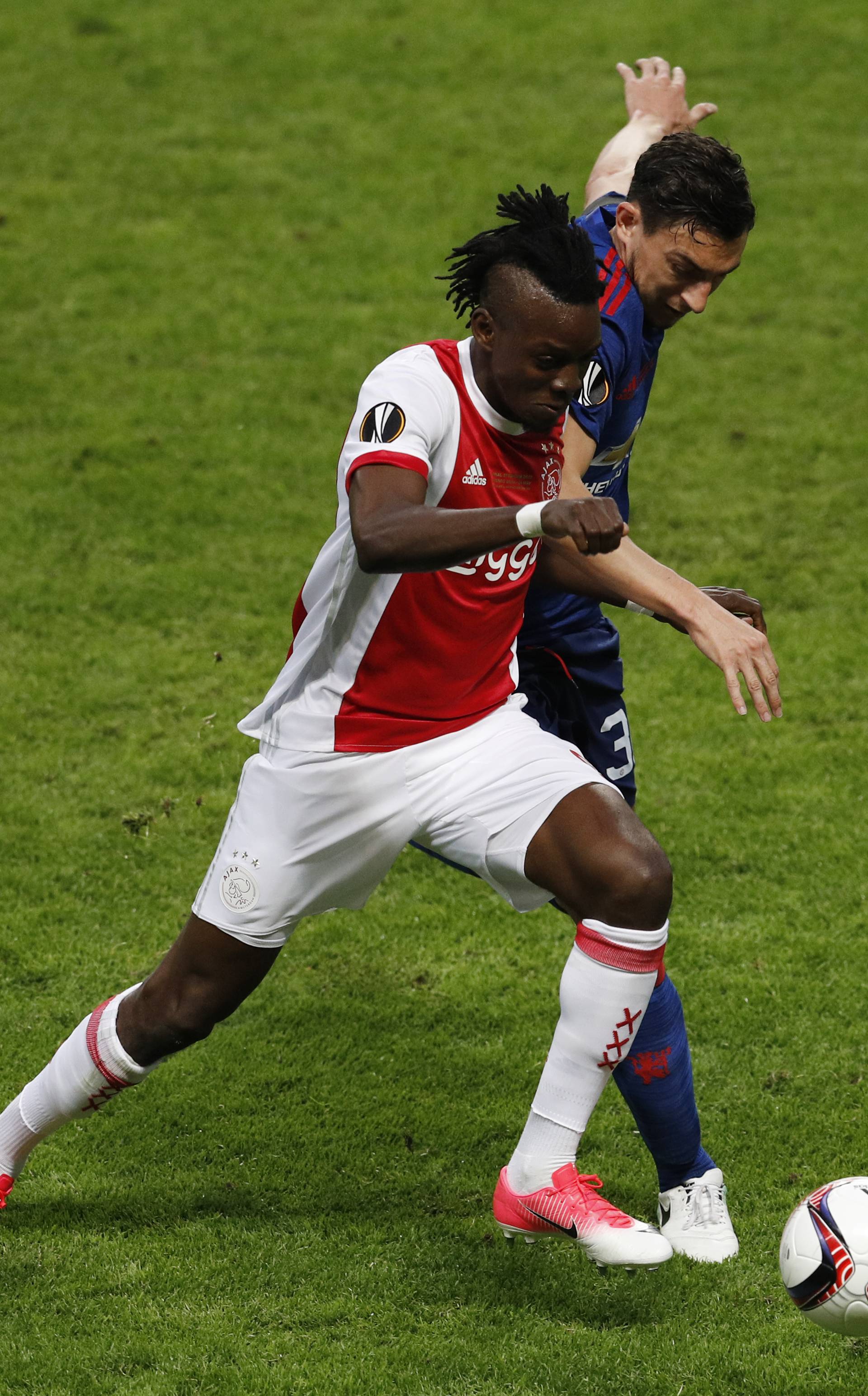 Ajax's Bertrand Traore in action with Manchester United's Matteo Darmian