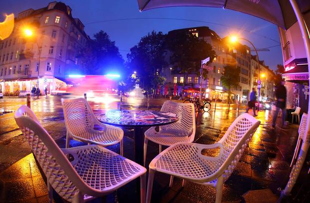 FILE PHOTO: An empty table is pictured before the late-night curfew due to restrictions against the spread of the coronavirus disease (COVID-19) in Berlin