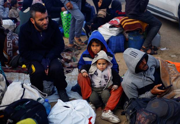 Displaced Palestinians wait to be allowed to return to their homes in northern Gaza, in the central Gaza Strip