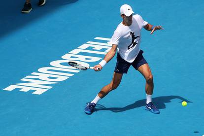 Novak Djokovic practices on court ahead of 2022 Australian Open