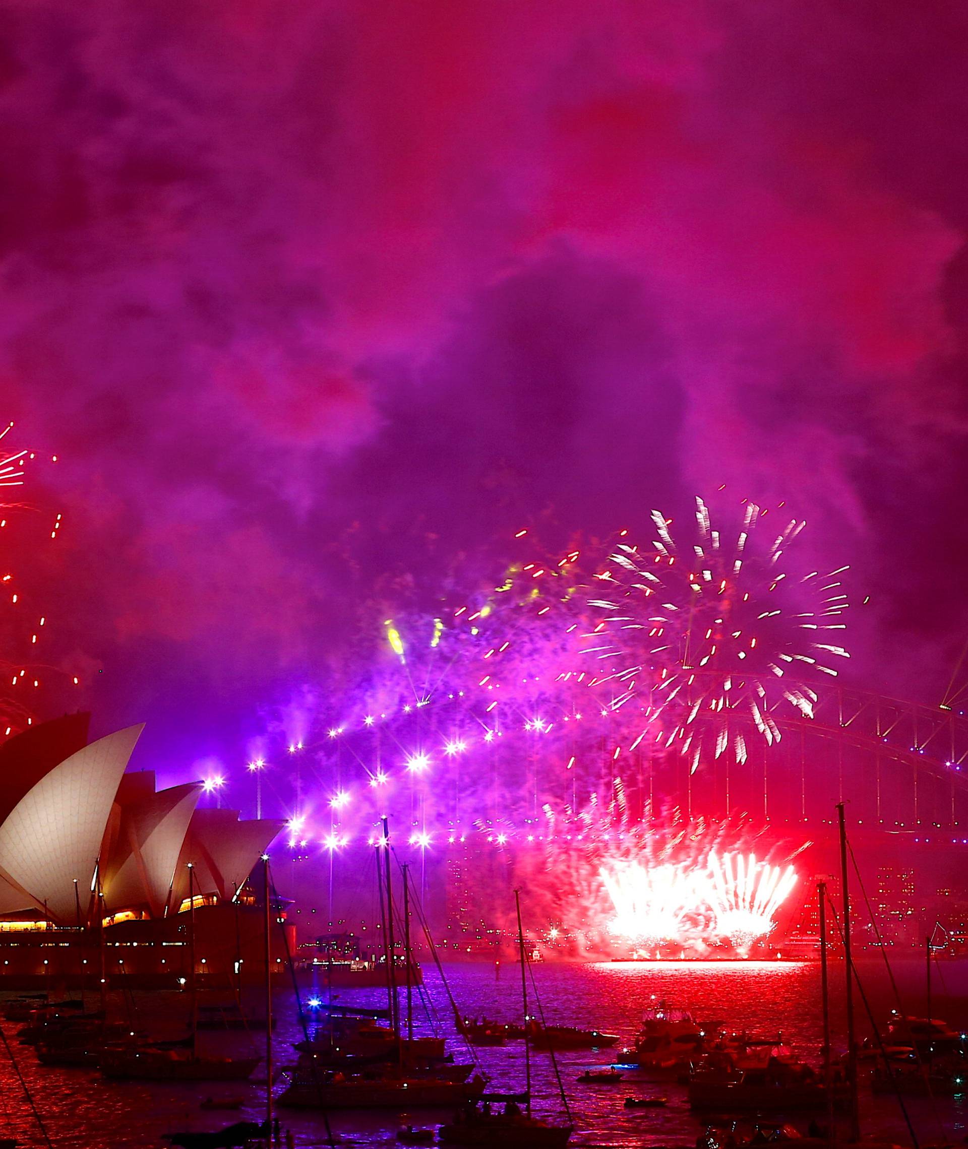 Fireworks light up the Sydney Harbour Bridge and Sydney Opera House as part of new year celebrations on Sydney Harbour