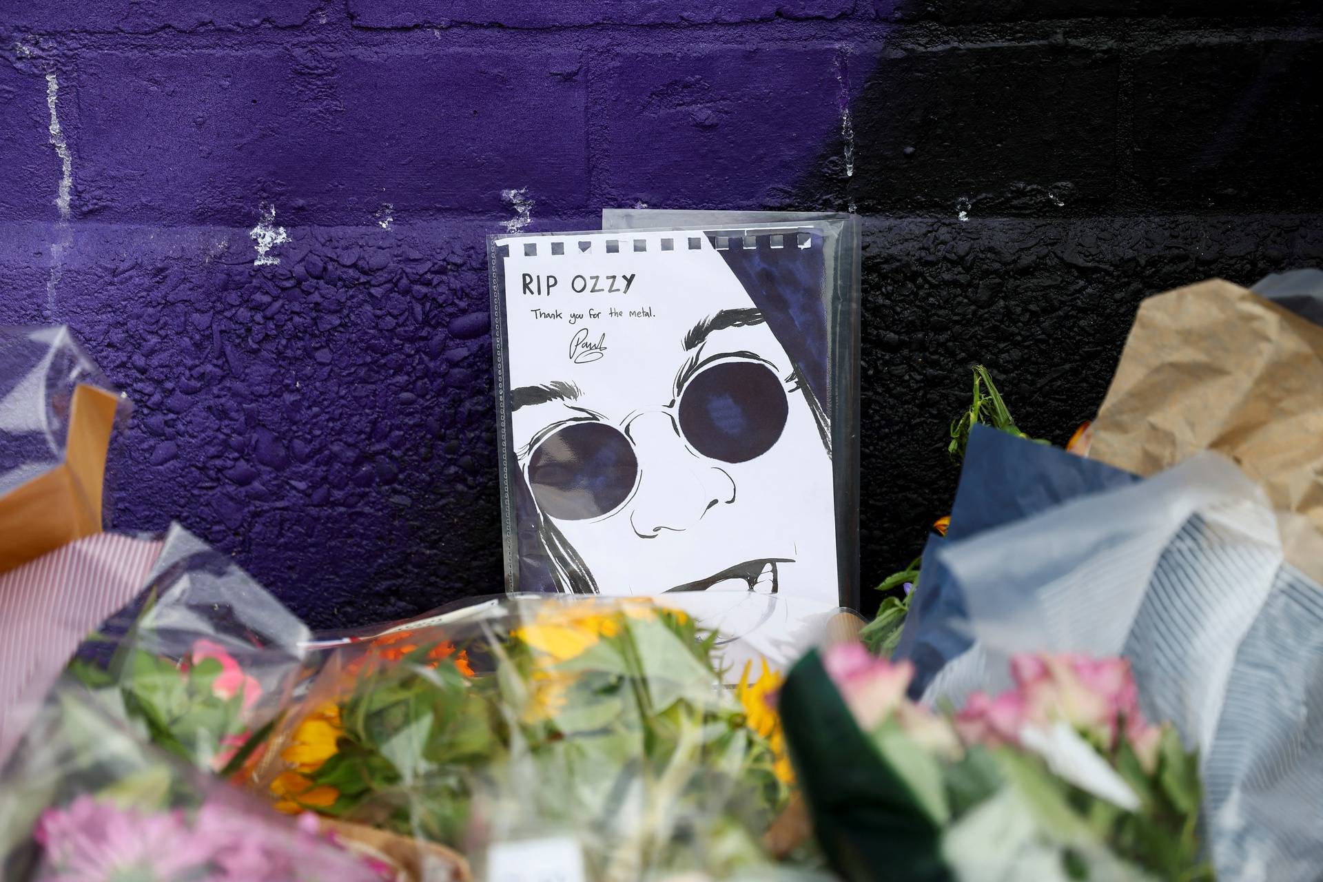 Fans pay tribute following the death of Ozzy Osbourne, in Birmingham