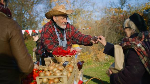 Senior,Farmer,Gives,Goods,In,Paper,Eco,Bag,To,Elderly