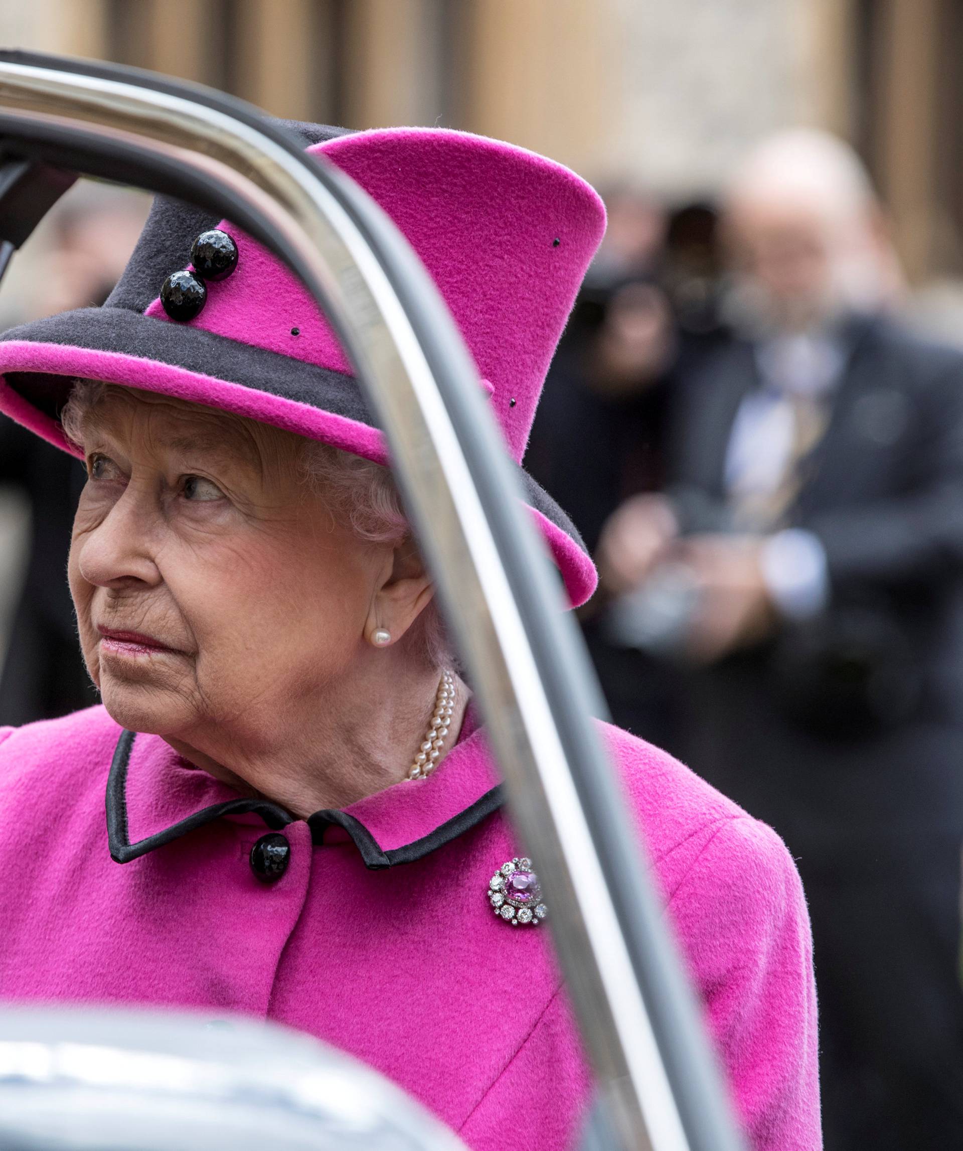 Britain's Queen Elizabeth talks to recipients of new "Motability" vehicles during a ceremony in Windsor Castle, Windsor