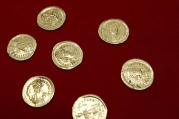 View of golden coins uncovered by Serbian archaeologists at the Viminacium site