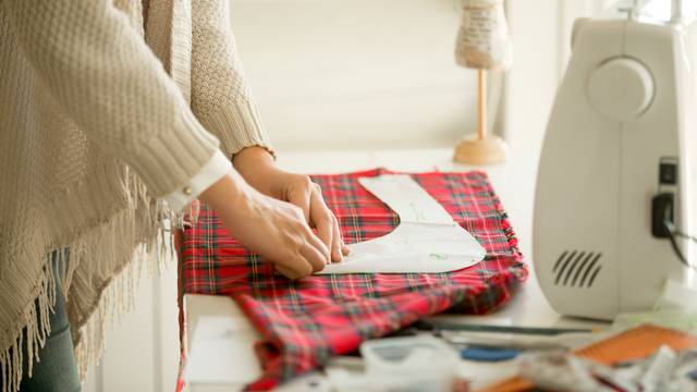 Woman working with a sewing pattern