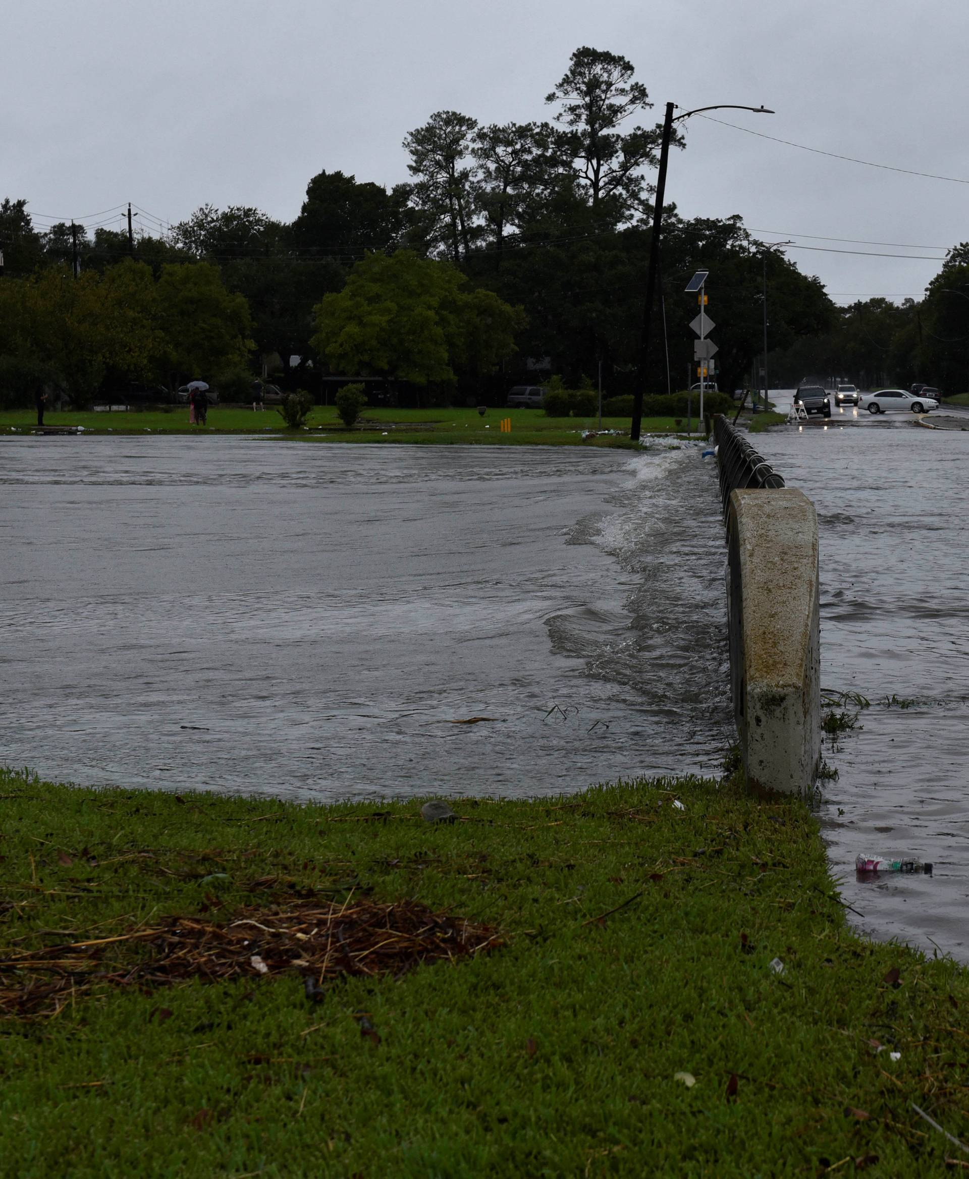 Brays Bayou flows over a bridge after Hurricane Harvey inundated the Texas Gulf coast with rain causing widespread flooding