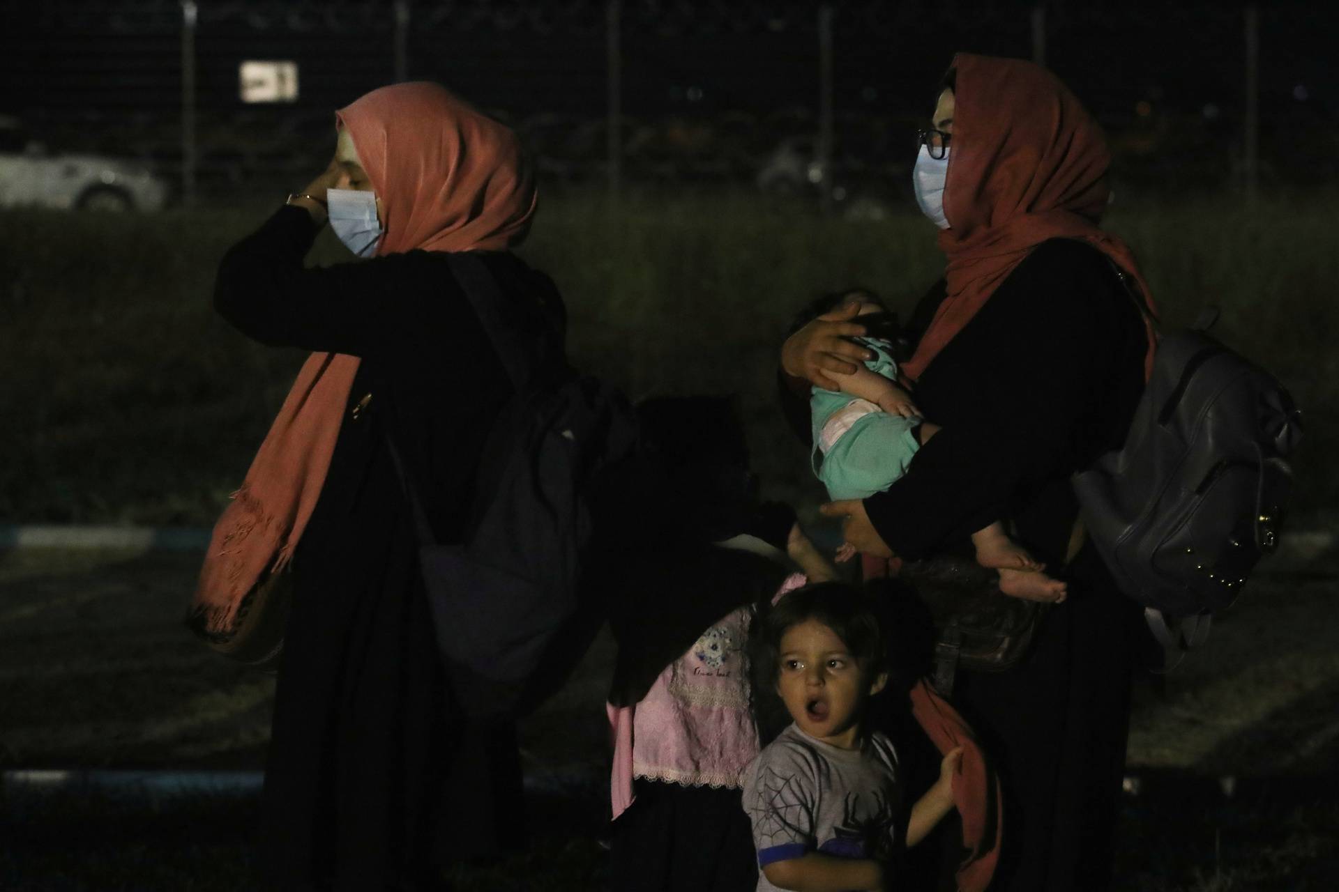 People evacuated from Afghanistan arrive at Tirana International Airport