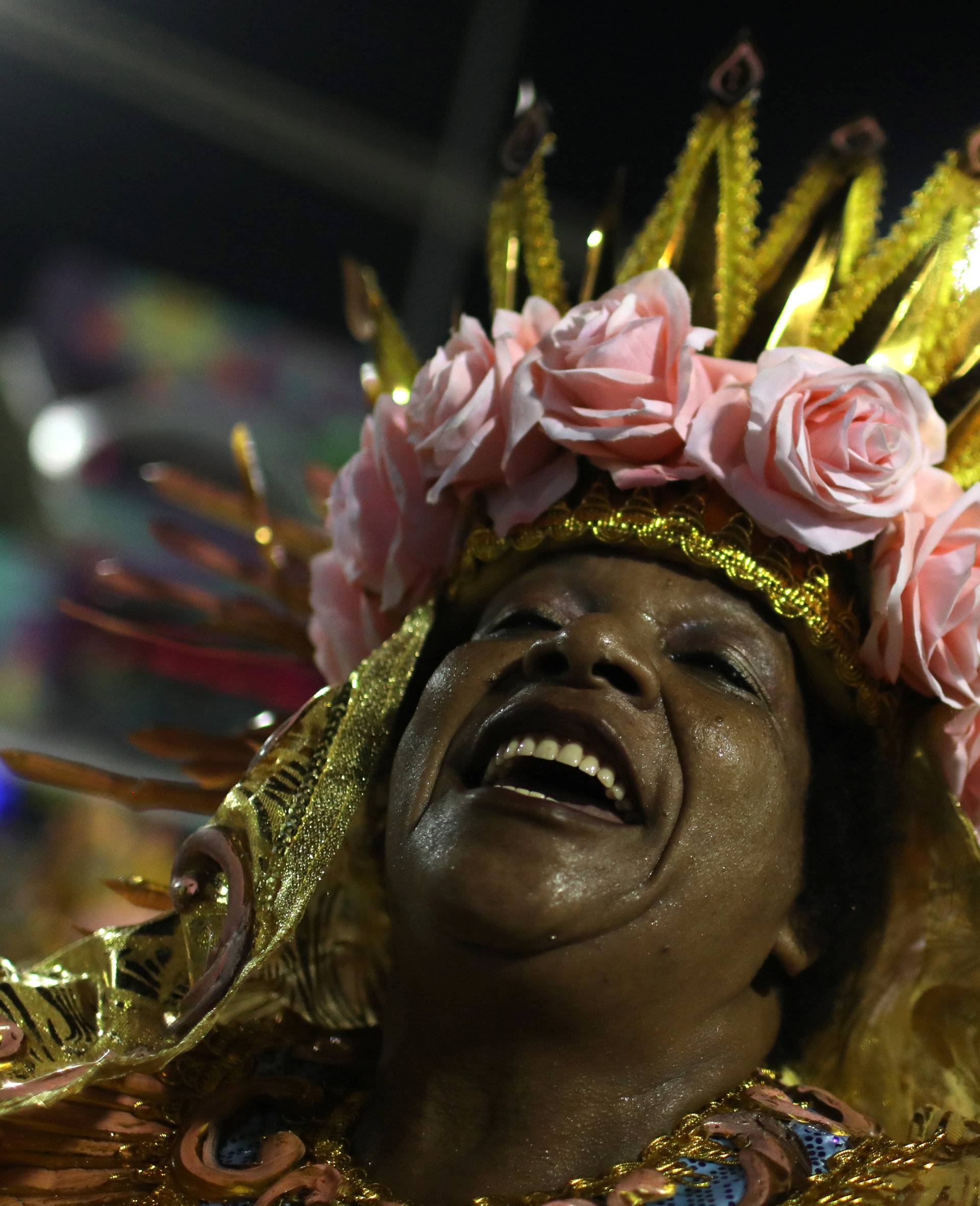 A reveller from Beija-Flor samba school performs during the second night of the Carnival parade at the Sambadrome in Rio de Janeiro