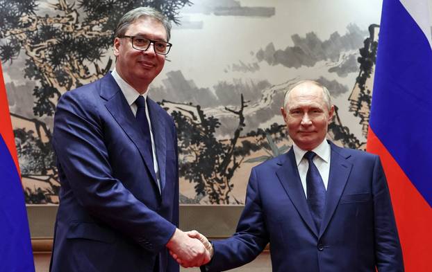Russian President Vladimir Putin meets with Serbian President Aleksandar Vucic in Beijing