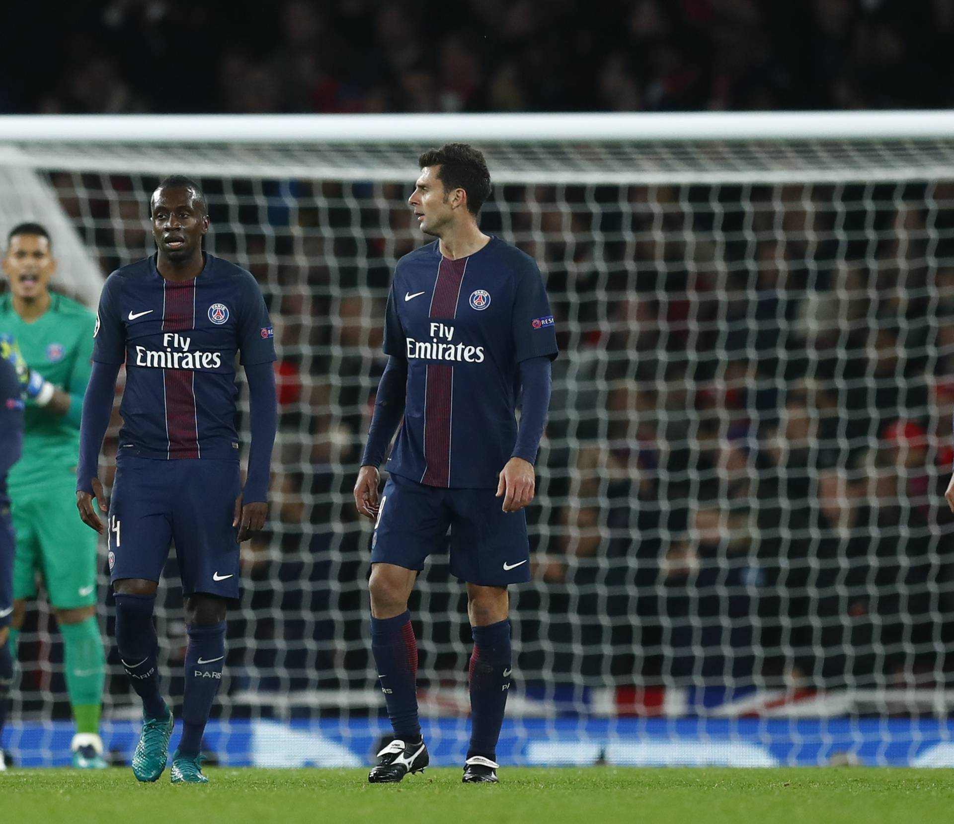 Paris Saint-Germain's Blaise Matuidi, Thiago Motta and Thiago Silva look dejected after Marco Verratti scores an own goal and the second goal for Arsenal