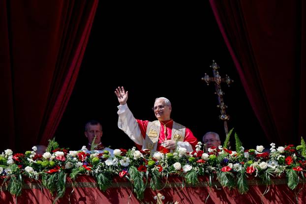 Pope Leo XIV delivers his "Urbi et Orbi" (To the city and the world) message from the main balcony of St. Peter's Basilica