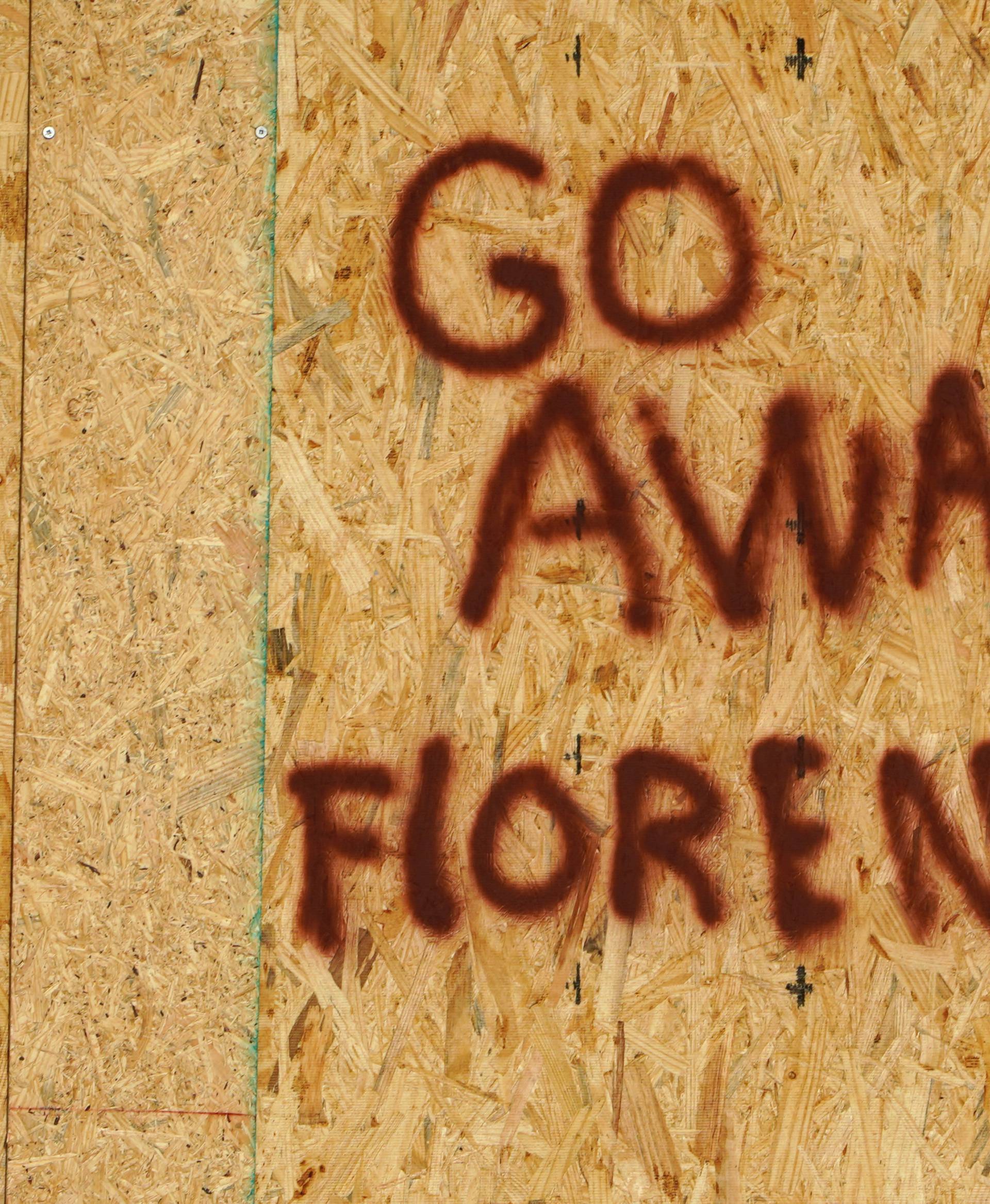 A message is posted on a boarded up building before the arrival of Hurricane Florence on Oak Island