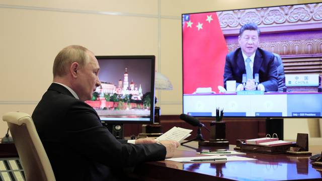 Russian President Vladimir Putin attends the G20 summit via a video link in Moscow