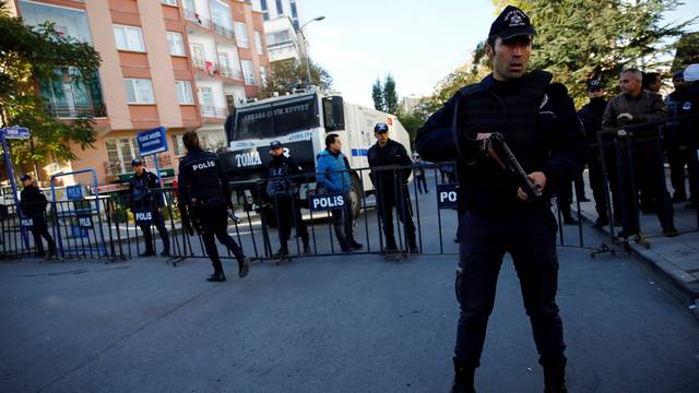 Riot police stand guard near the pro-Kurdish HDP headquarters in Ankara