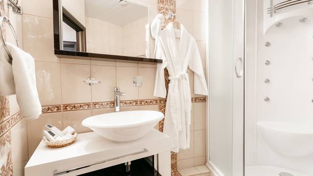 Bathroom Inside rooms of a apartment or hotel. Clean white towel