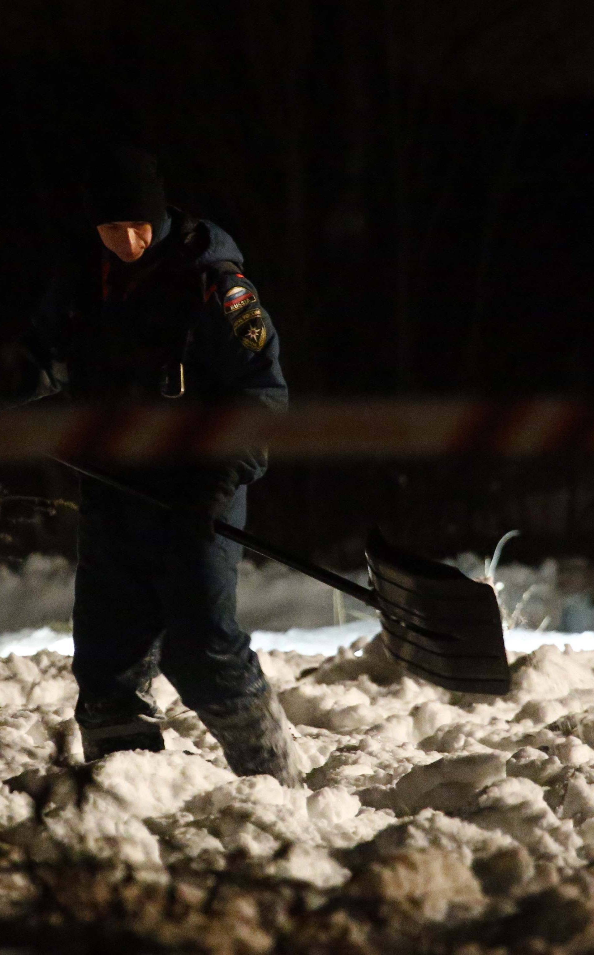 Emergency services work at the scene where a Saratov Airlines Antonov AN-148 plane crashed after taking off from Moscow's Domodedovo airport, outside Moscow