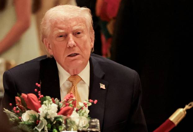 U.S. President Trump takes part in a Christmas Eve dinner in the ballroom of his Mar-a-Lago club in Palm Beach